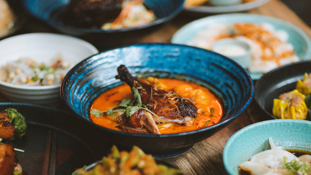 Table full of vibrant modern Asian dishes from Dragonfly restaurant Wellington.