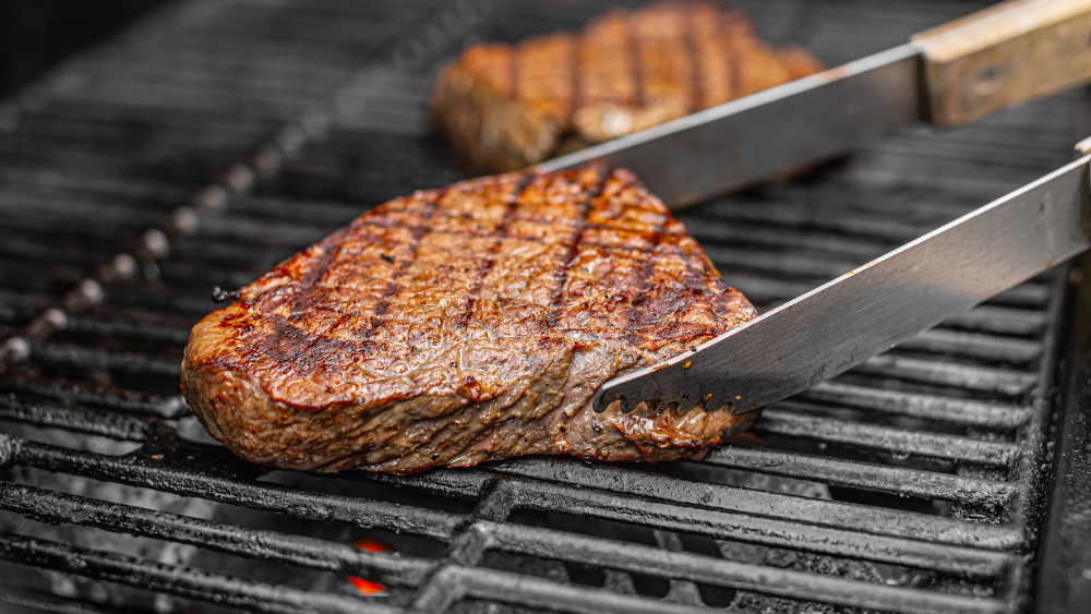 Cooking steak with gas.