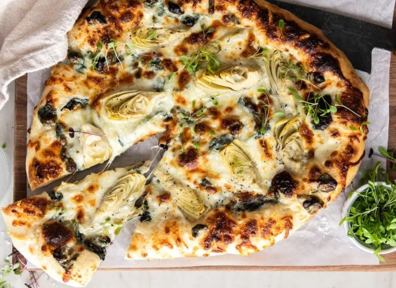 Spinach and Artichoke Pizza with Cheesy Bread Crust.