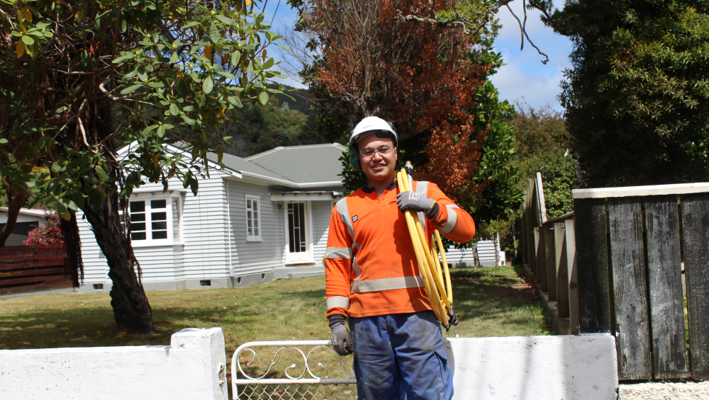 Worker connecting home to gas